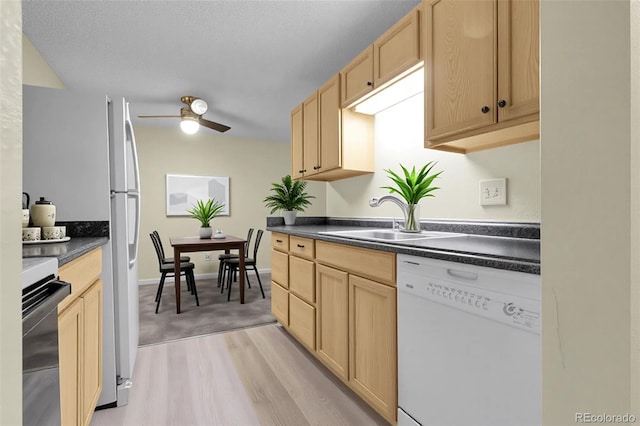 2325 S Linden Ct Unit 206, Denver, CO 80222 - kitchen featuring white appliances, dark countertops, light brown cabinets, and ceiling fan