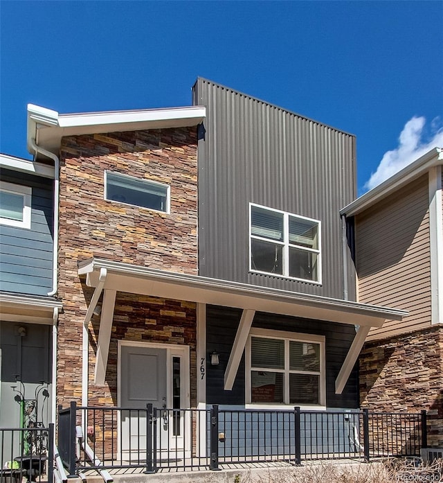 767 Robert St, Longmont, CO 80503 - view of front of house featuring stone siding and a porch