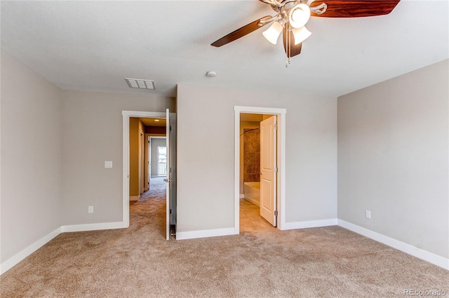 767 Robert St, Longmont, CO 80503 - unfurnished bedroom featuring light carpet, baseboards, ceiling fan, and ensuite bath