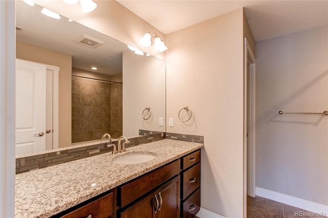 767 Robert St, Longmont, CO 80503 - full bath featuring vanity, tile patterned floors, and baseboards