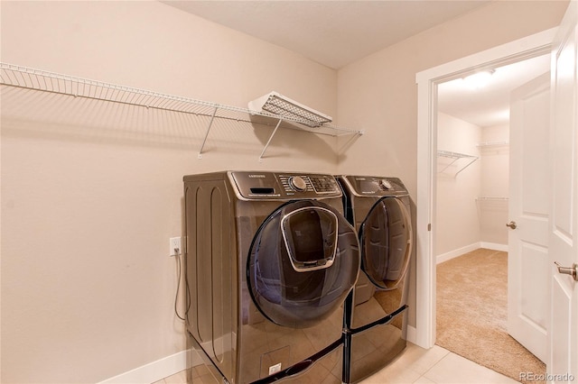 767 Robert St, Longmont, CO 80503 - laundry room with washing machine and clothes dryer, baseboards, light carpet, and light tile patterned floors