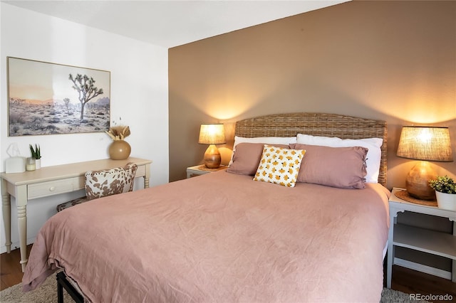 bedroom with wood finished floors