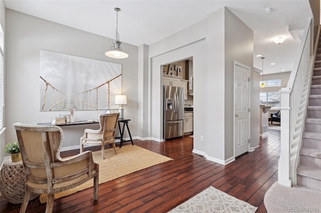 sitting room featuring dark wood-type flooring