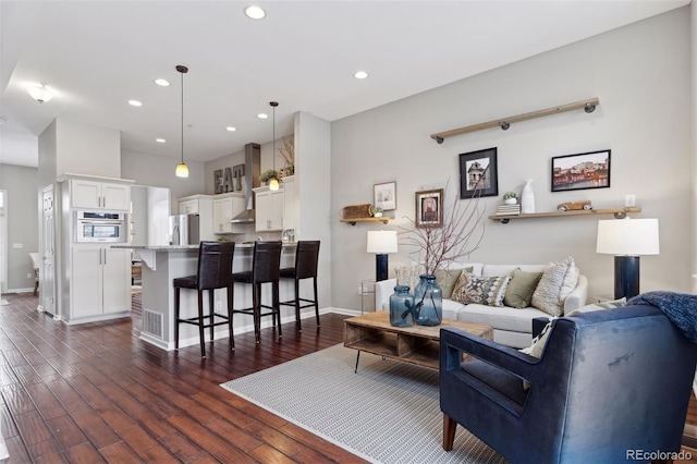 living room featuring dark hardwood / wood-style flooring