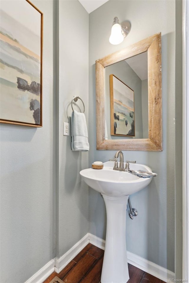 bathroom with wood-type flooring