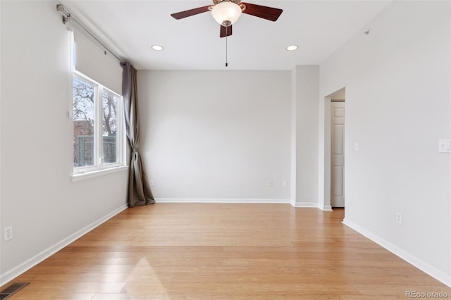 empty room featuring light wood-type flooring and ceiling fan