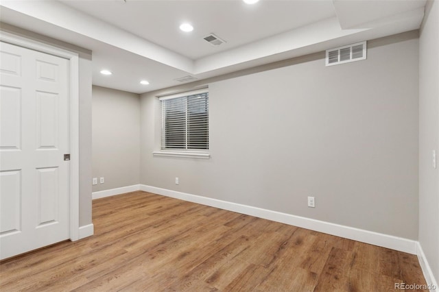 basement featuring light hardwood / wood-style floors