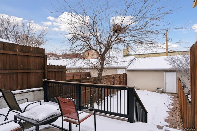 view of snow covered deck