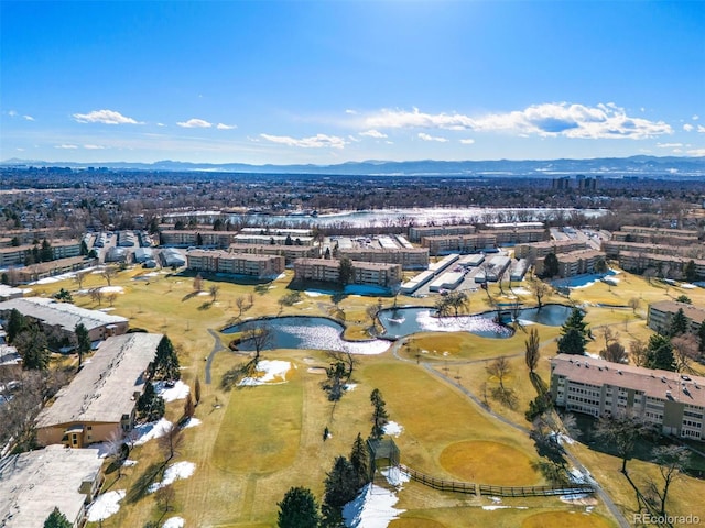 drone / aerial view featuring a water and mountain view