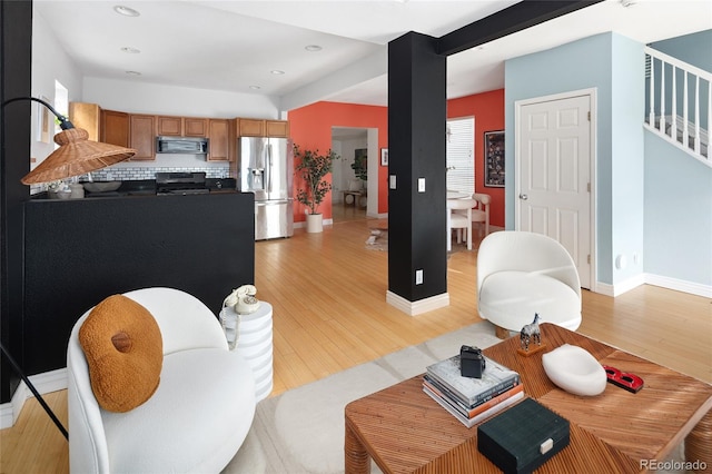 living room with light hardwood / wood-style flooring