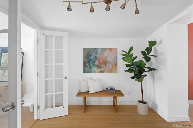 interior space featuring vaulted ceiling and hardwood / wood-style floors