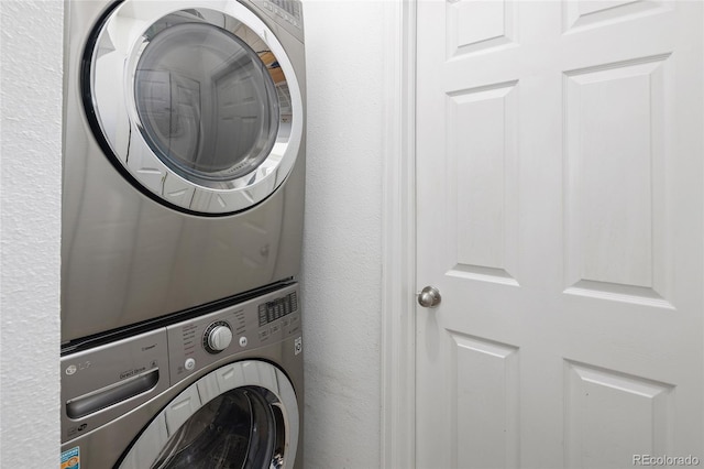 laundry room with stacked washer and dryer