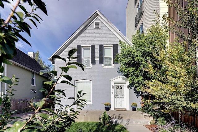 1473 Yates St, Denver, CO 80204 - victorian house with brick siding and fence