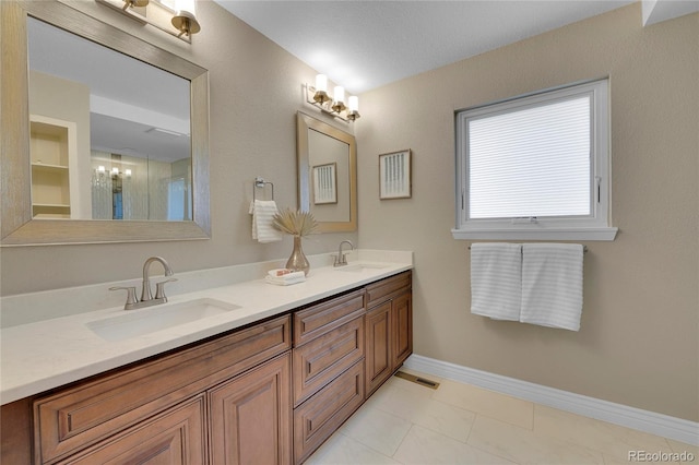 bathroom with tile patterned flooring and vanity