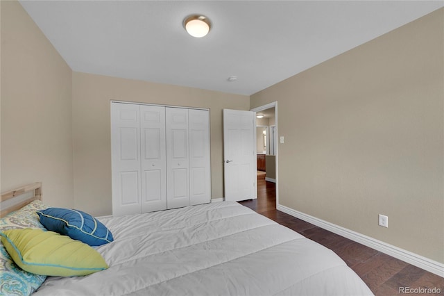 bedroom featuring a closet and dark wood-type flooring