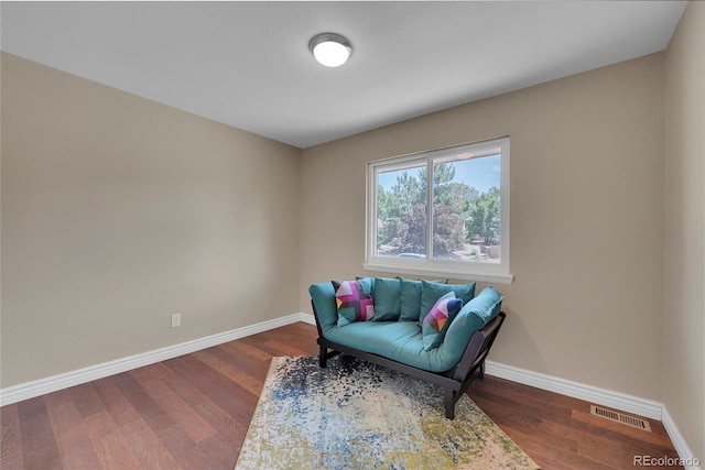 living area with dark hardwood / wood-style flooring