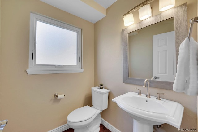 bathroom featuring sink and toilet