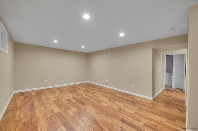 empty room with light hardwood / wood-style floors