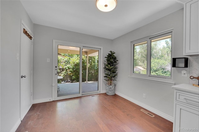 unfurnished dining area featuring light hardwood / wood-style floors