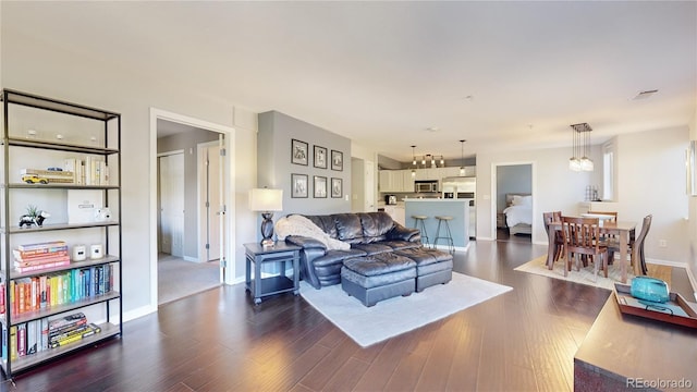 living room with dark hardwood / wood-style floors