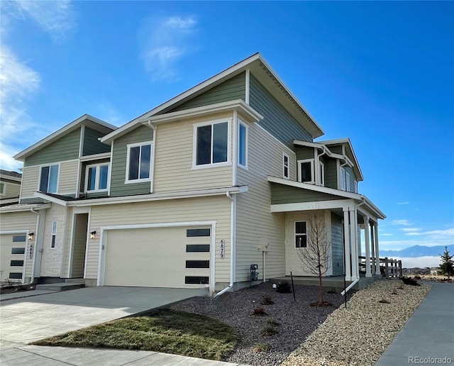 view of front facade featuring concrete driveway and an attached garage