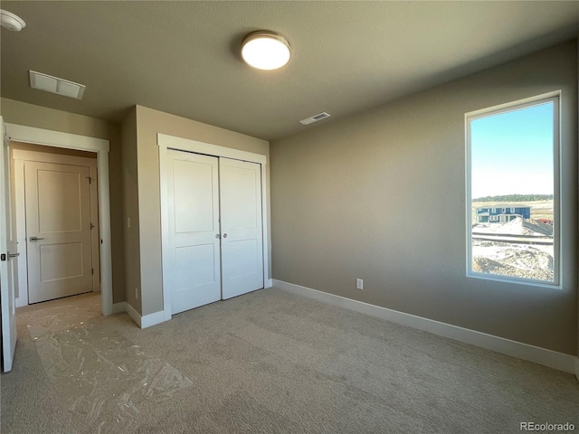 unfurnished bedroom with a closet