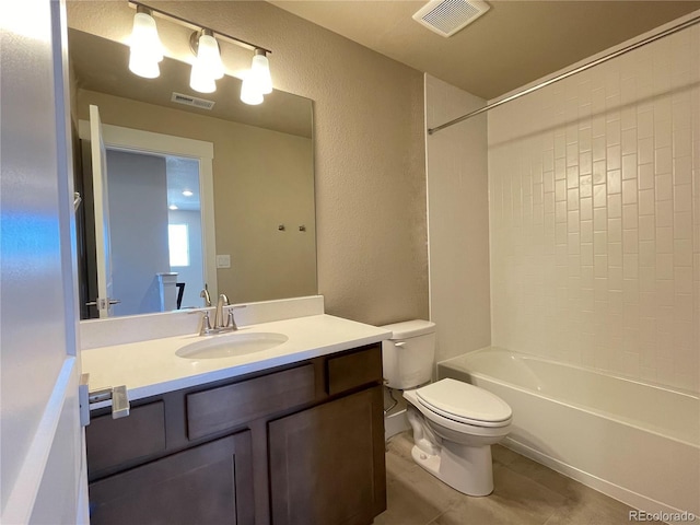 full bathroom featuring tile patterned floors, vanity, toilet, and bathing tub / shower combination