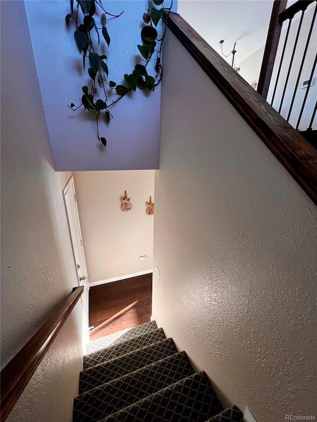 stairway with vaulted ceiling