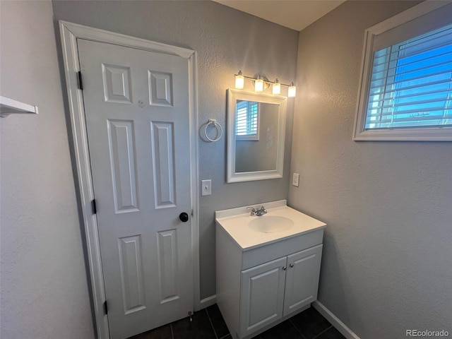 bathroom with vanity and tile patterned floors