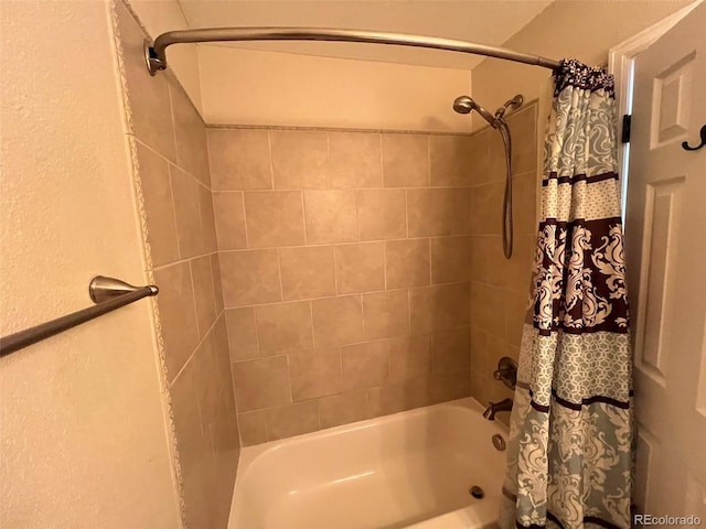 bathroom with shower / bath combo