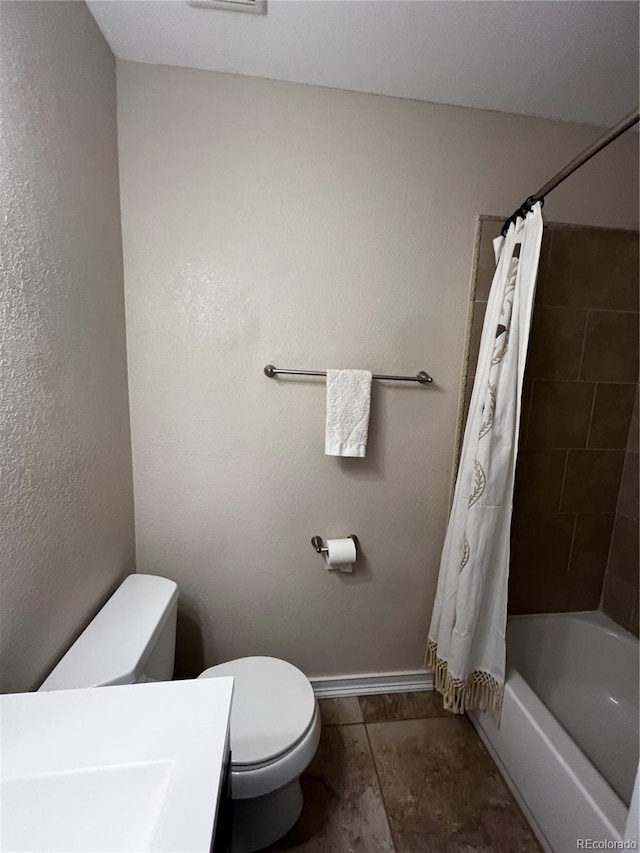 bathroom with shower / bath combo with shower curtain and toilet