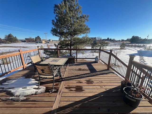 view of snow covered deck