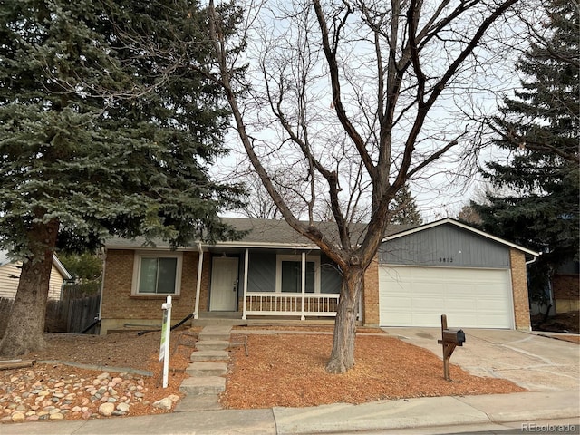 view of front facade with covered porch and a garage