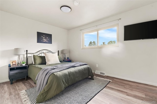 6254 W 79th Ave, Arvada, CO 80003 - bedroom featuring baseboards and wood finished floors