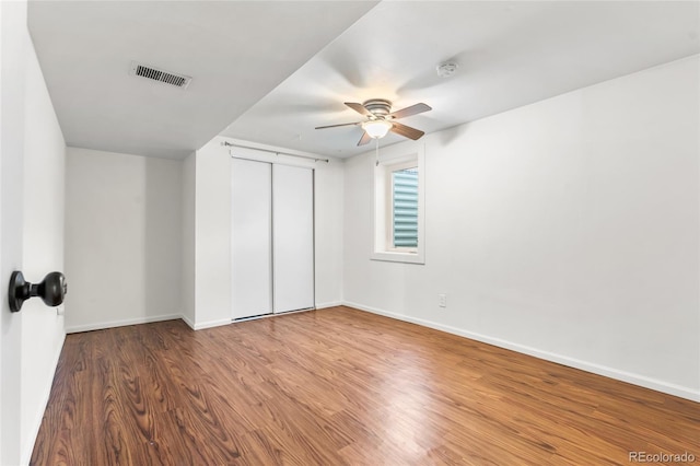 6254 W 79th Ave, Arvada, CO 80003 - unfurnished bedroom with wood finished floors, a closet, and a ceiling fan