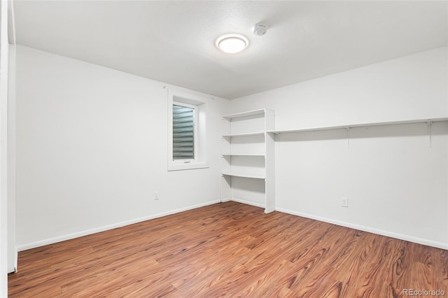 6254 W 79th Ave, Arvada, CO 80003 - spare room featuring wood finished floors and a smoke detector