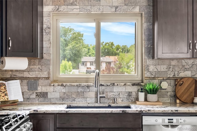 6254 W 79th Ave, Arvada, CO 80003 - kitchen featuring dishwasher, dark brown cabinetry, tasteful backsplash, and healthy amount of natural light
