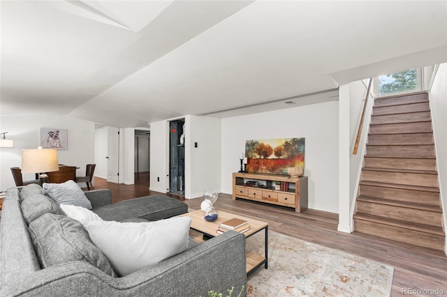 6254 W 79th Ave, Arvada, CO 80003 - living area featuring stairway, lofted ceiling, and wood finished floors