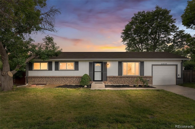 6254 W 79th Ave, Arvada, CO 80003 - single story home featuring brick siding, a garage, concrete driveway, and a front yard