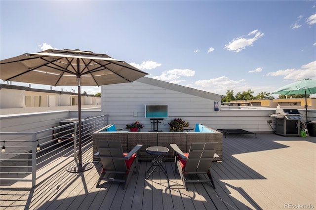 deck featuring a grill