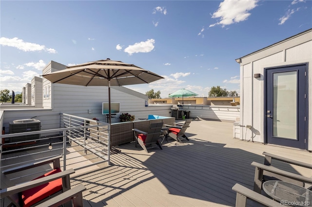 deck featuring an outdoor living space and central AC unit