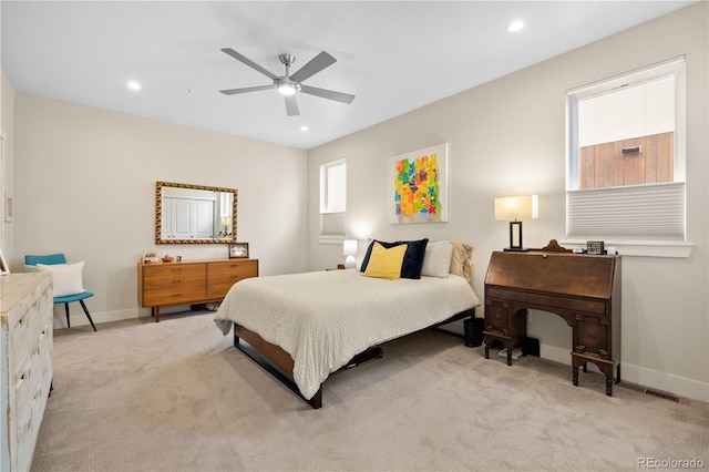 bedroom featuring light colored carpet, recessed lighting, and baseboards
