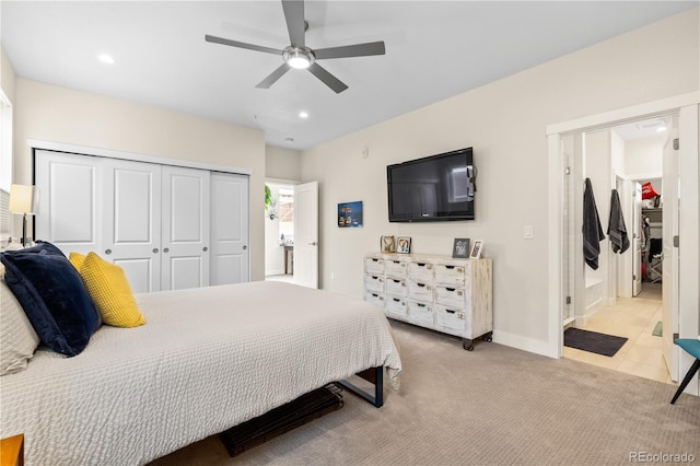 bedroom with a closet, recessed lighting, a ceiling fan, and light colored carpet