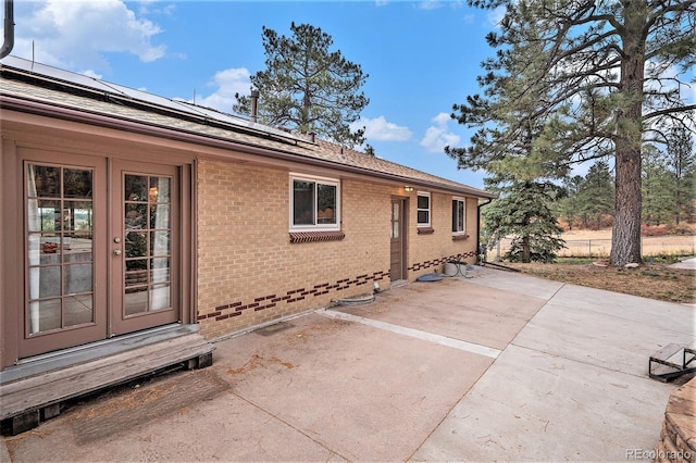 exterior space featuring a patio and solar panels