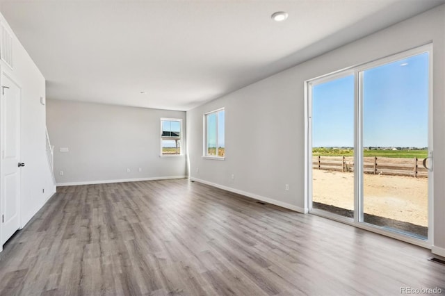 unfurnished living room with hardwood / wood-style floors