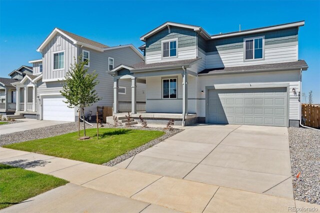 view of front facade featuring a garage and a front lawn