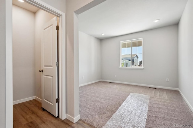 spare room with hardwood / wood-style flooring