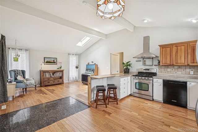 280 Pierce St, Erie, CO 80516 - kitchen featuring dishwasher, stainless steel range with gas cooktop, wall chimney exhaust hood, a peninsula, and a skylight