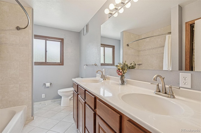 280 Pierce St, Erie, CO 80516 - full bathroom featuring toilet, healthy amount of natural light, double vanity, and tile patterned flooring