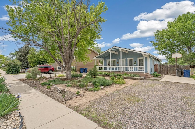 280 Pierce St, Erie, CO 80516 - view of front of house with covered porch, driveway, and board and batten siding